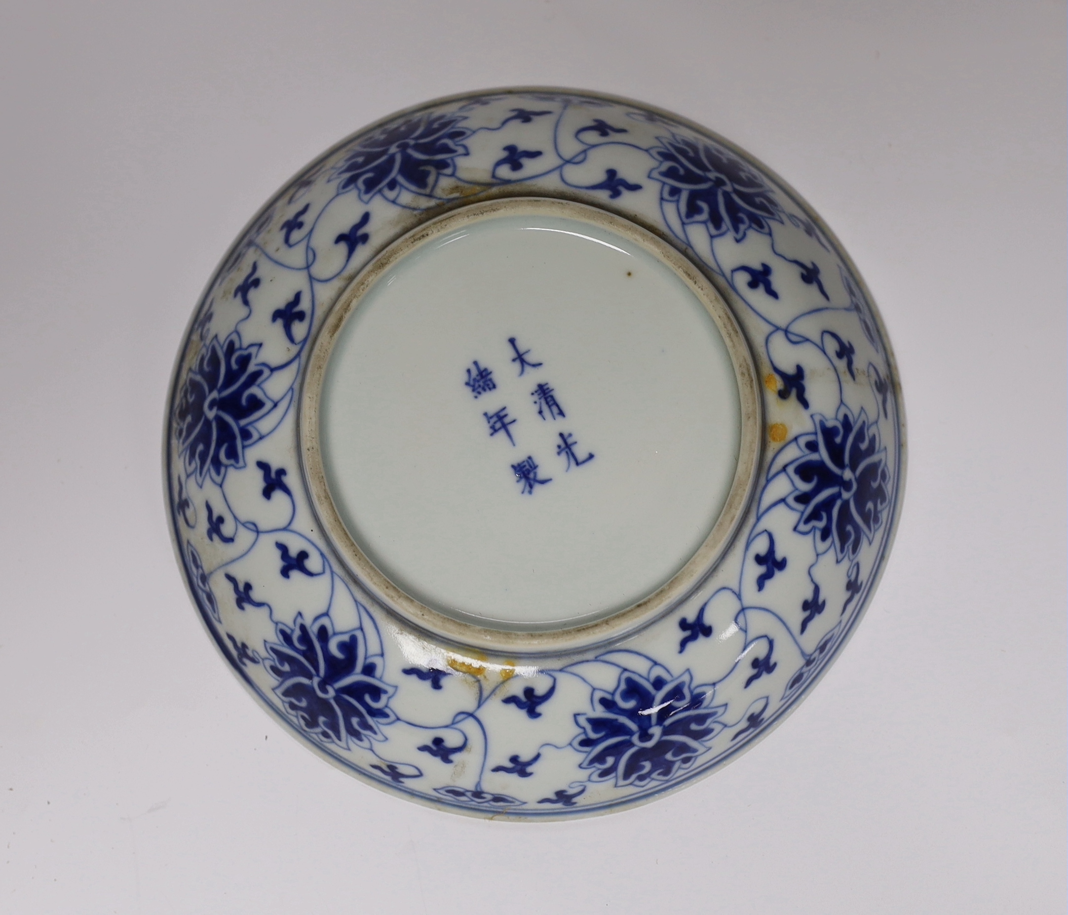 A Chinese blue and white lotus saucer dish, Guangxu mark and of the period (1875-1908), 15.5cm diameter